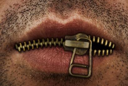 mans-mouth-bronze-or-gold-metal-zipper-closing-lips-shut